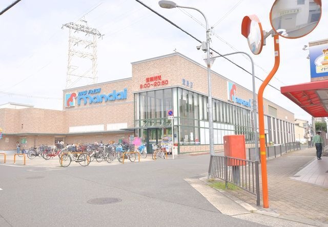 写真：万代萱島店